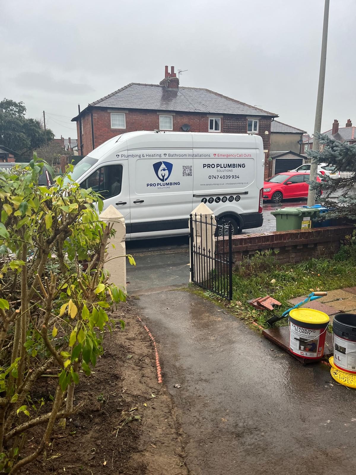 Pro Plumbing Solutions emergency call out van parked outside a customer's home